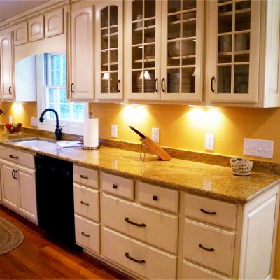 white kitchen with marble countertop and yellow soft lights virginia beach va 1
